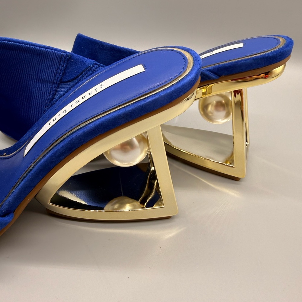 Gianni Bini Paityn suede mules in blue with a gold architectural heel.